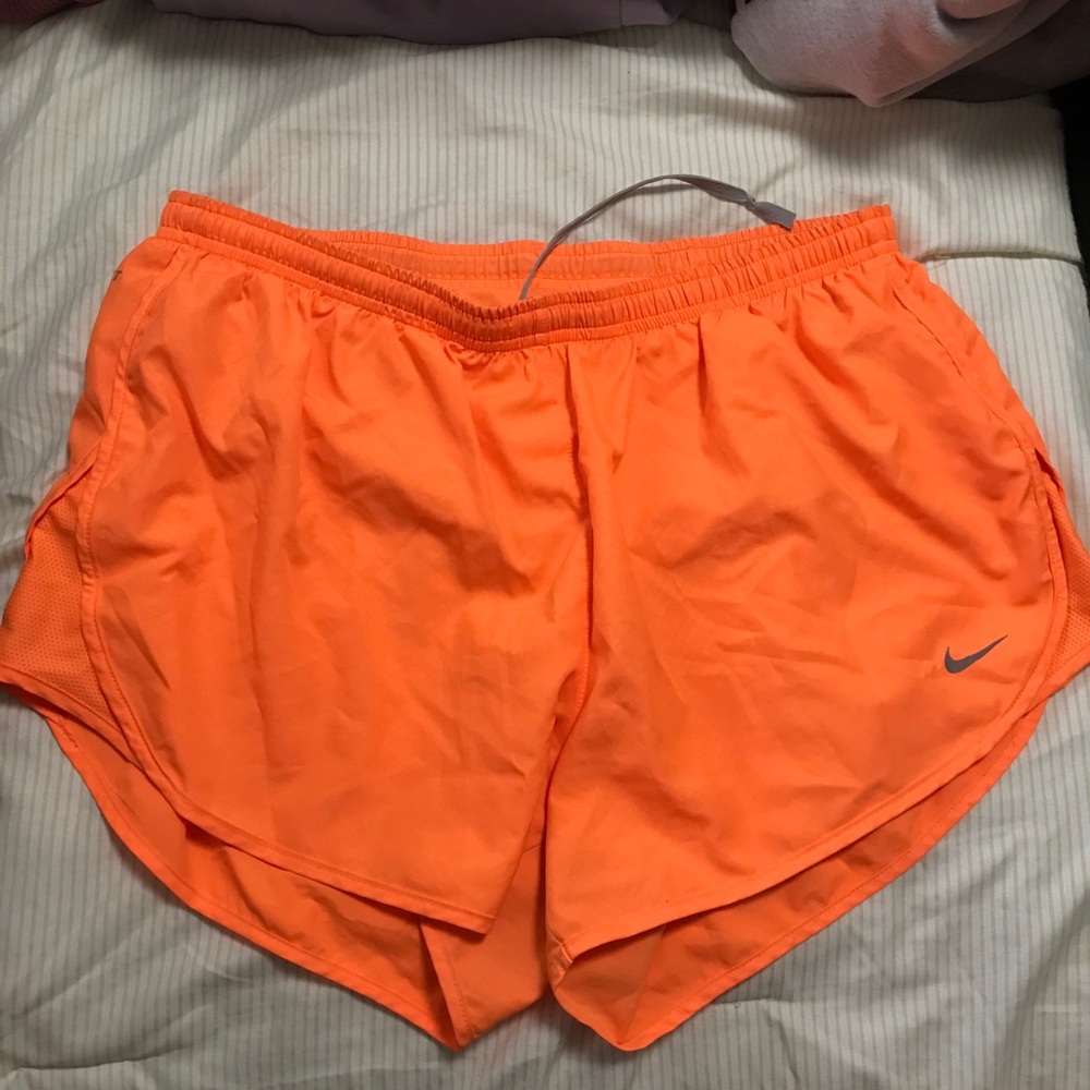 Bright orange Nike shorts